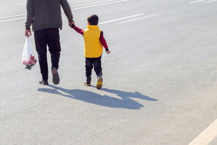 Person And Child Crossing Street Illegally