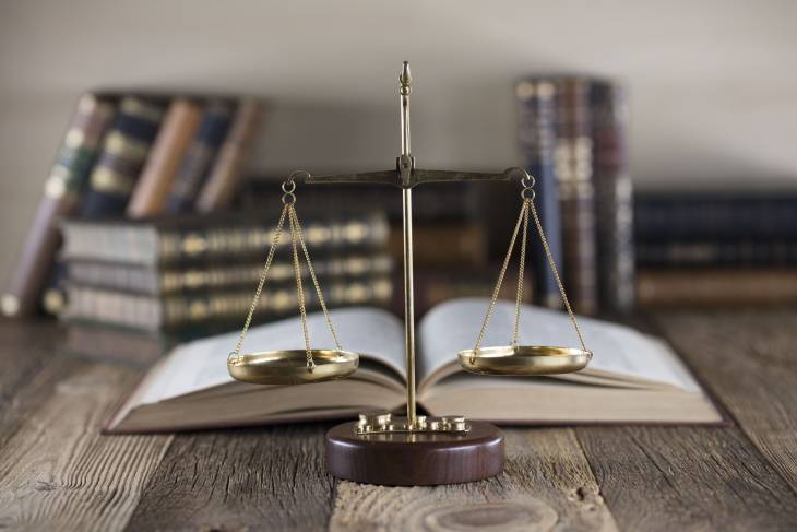 Photo of a scales and a book on the table