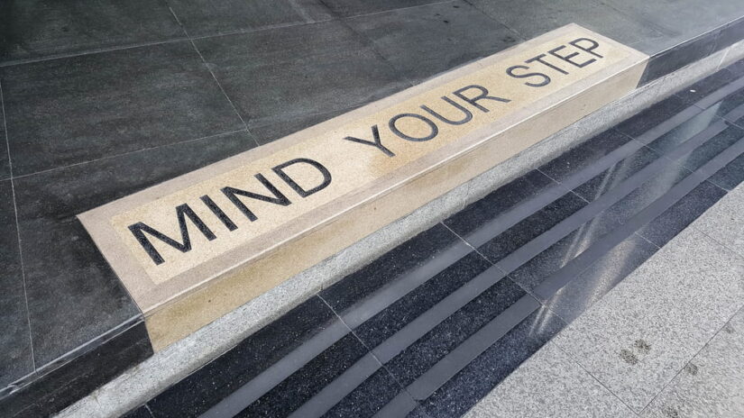 Mind Your Step Sign On The Floor