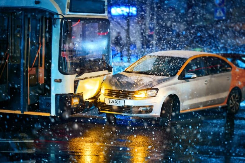 A Crash Scene Between A Bus And A Silver Car